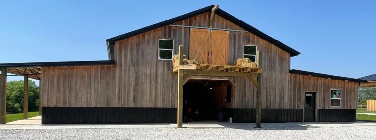 Wood-sided barndominium with hay loft built by JSC Contracting in Florida